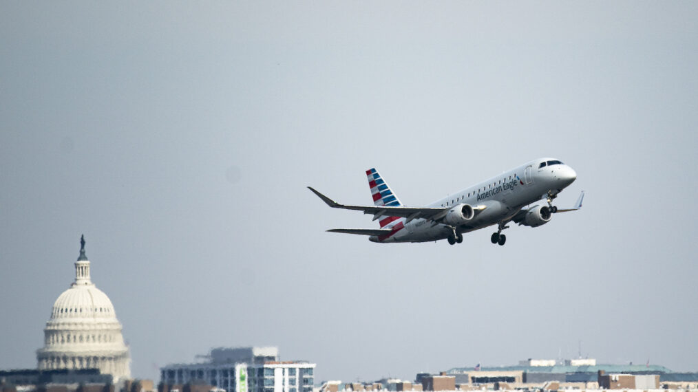 ARLINGTON, VIRGINIA - JANUARY 30: A plane takes off from Reagan National Airport after the crash last night of an American Airlines plane on the Potomac River as it approached the airport on January 30, 2025 in Arlington, Virginia. The American Airlines flight from Wichita, Kansas collided midair with a military Black Hawk helicopter while on approach to Ronald Reagan Washington National Airport. According to reports, there were no survivors among the 67 people on both aircraft.