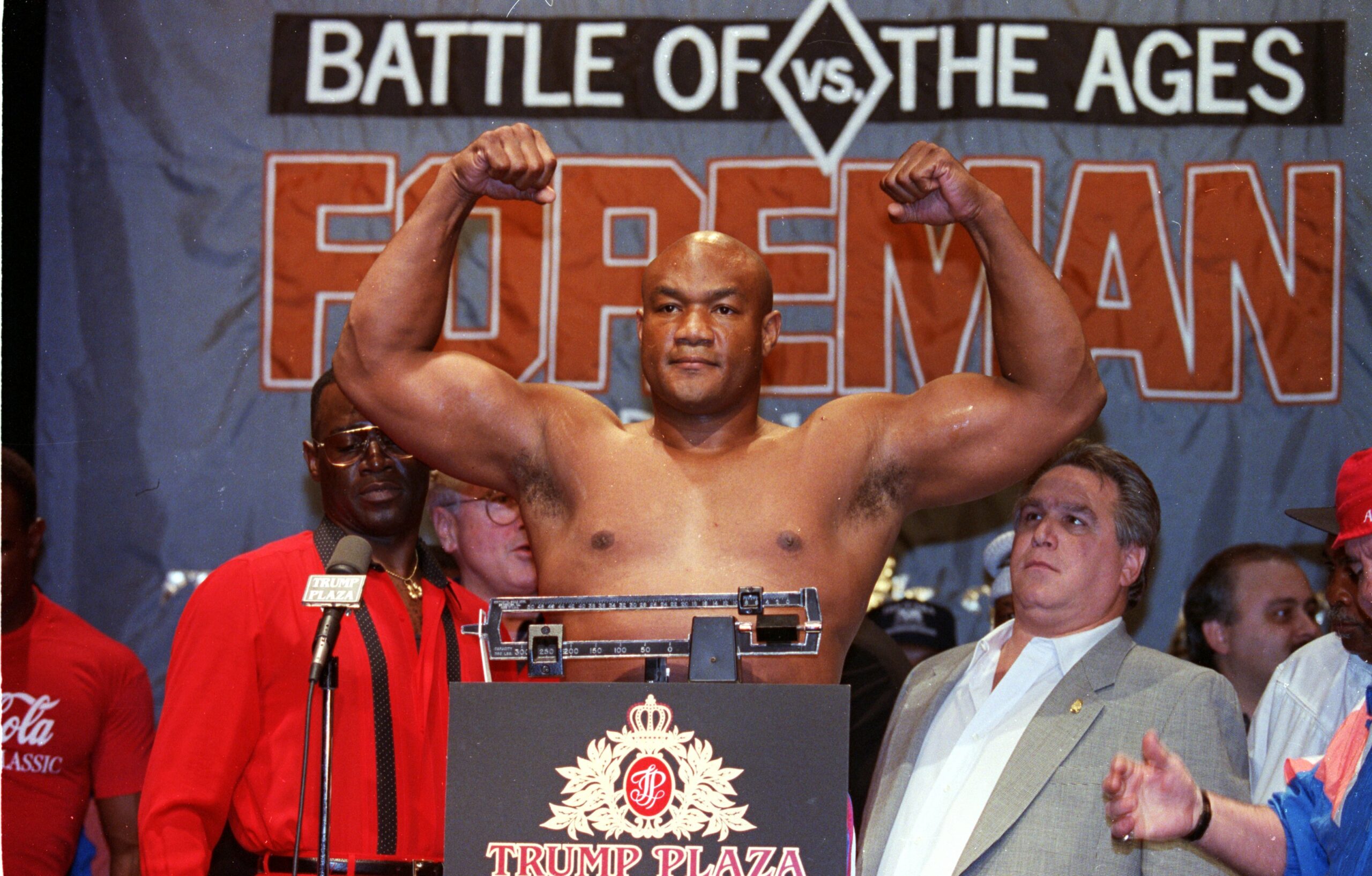 19 Apr 1991: George Foreman raises his arms as he weighs in before the fight against Evander Holyfield at the Trump Plaza in Atlantic City, New Jersey. Mandatory