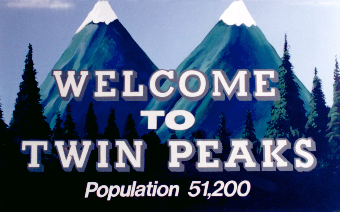 TWIN PEAKS, town welcome sign billboard, with population total, 1990-1991.