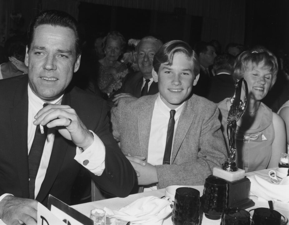 American actor Kurt Russell (C) smiles at the Spotlighter Teen Awards dinner with his parents, Bing and Louise Russell. October 1966: