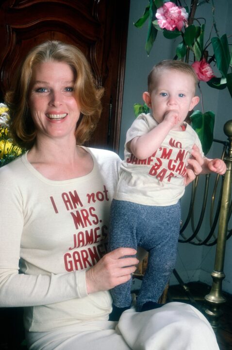 Mariette Hartley (left), who appeared a series of TV commercials for Polaroid with James Garner in the 1970s and 80s, causing many viewers to believe they were married in real life, wearing a T-shirt she had printed with the phrase, 'I am not Mrs. James Garner,' holding daughter Justine Boyriven, wearing a T-shirt Hartley printed with the phrase, 'I am not James Garner's baby,' 1979.