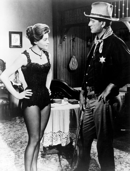 RIO BRAVO, from left, Angie Dickinson, John Wayne, 1959