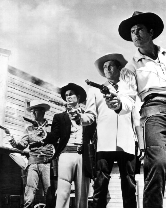 Warners TV Western stars WILL HUTCHINS [Sugarfoot], JAMES GARNER [Maverick], WAYDE PRESTON [Colt 45] and CLINT WALKER [Cheyenne] pose for a studio publicity shot, c. 1958