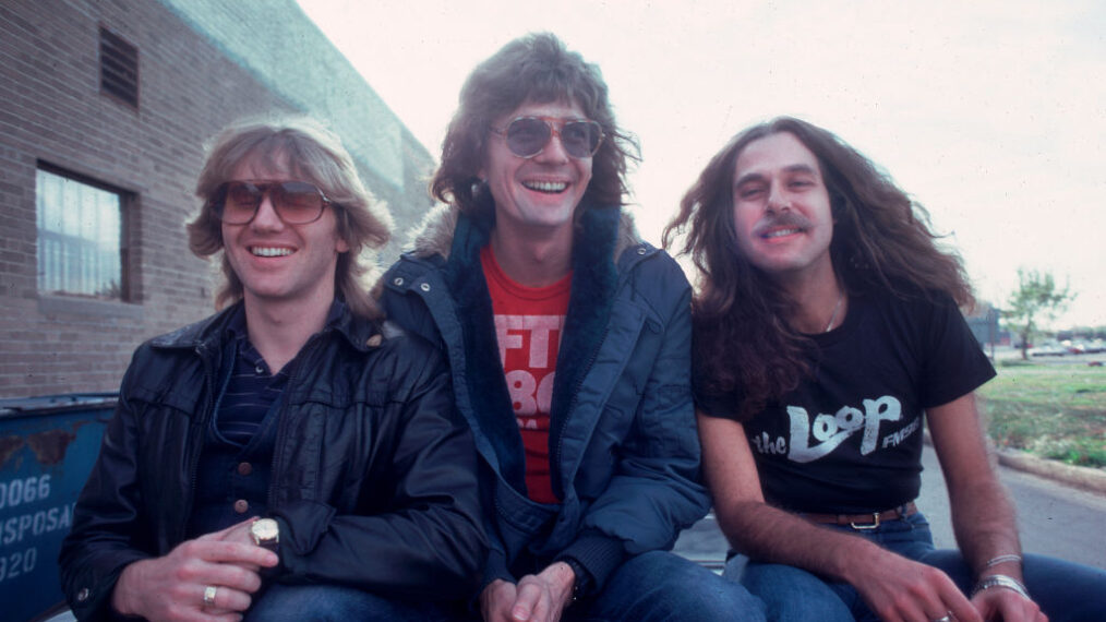 Portrait of the members of Canadian heavy metal group Triumph as they pose outdoors, Chicago, Illinois, October 9, 1981. Pictured are Rik Emmett, Gil Moore, and Mike Levine