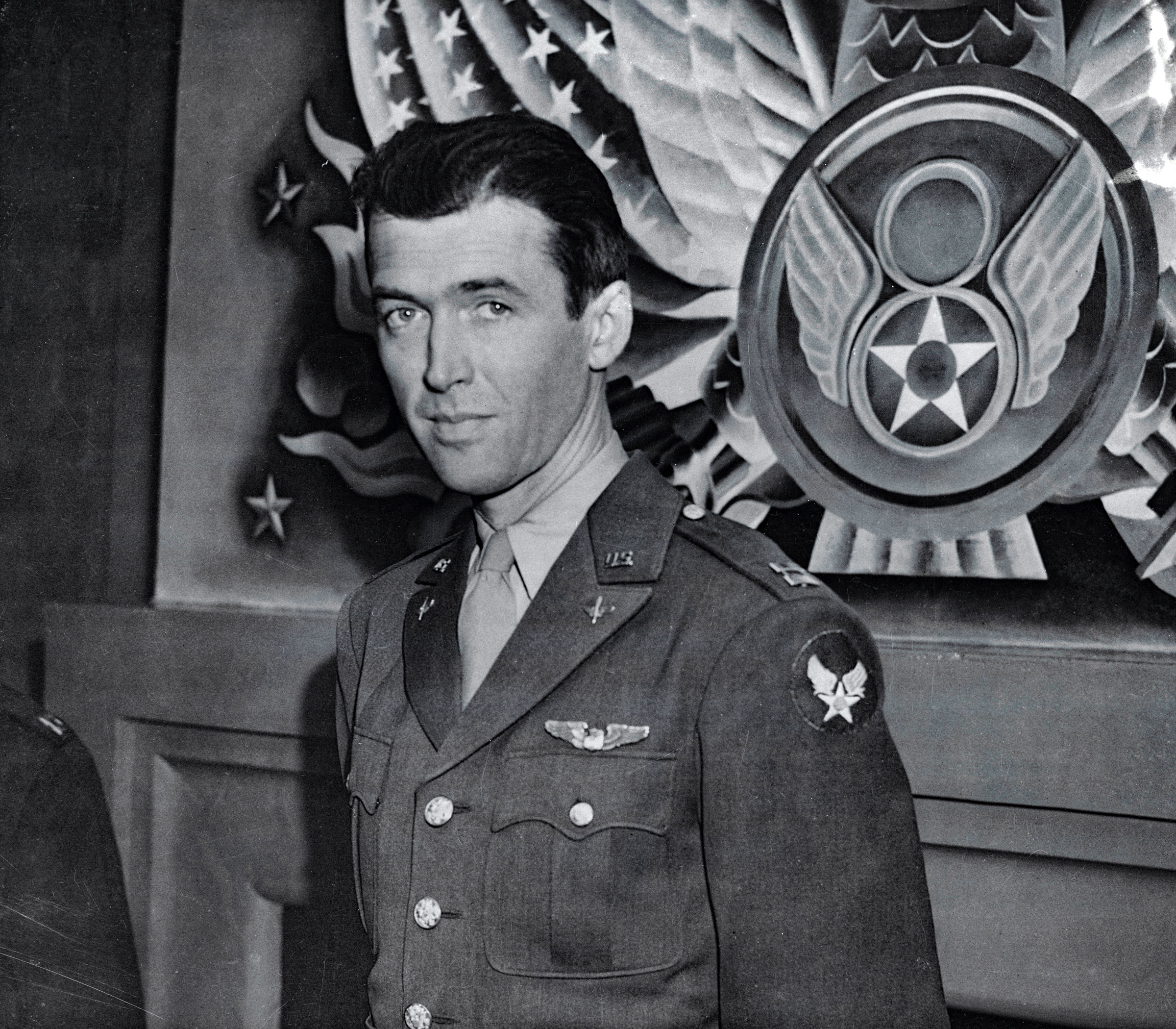 Captain James Stewart has changed his occupation from making feminine hearts throb to making bomber motors roar over occupied territory. The popular film star has arrived in Britain where he commands a squadron of liberator bombers. Captain Stewart, who enlisted in the United States Army nearly three years ago, was a private for nine months. (Original Caption) Commands Bomber Squadron. England: