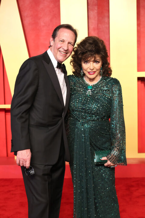 Percy Gibson and Joan Collins attend the 2024 Vanity Fair Oscar Party Hosted By Radhika Jones at Wallis Annenberg Center for the Performing Arts on March 10, 2024 in Beverly Hills, California