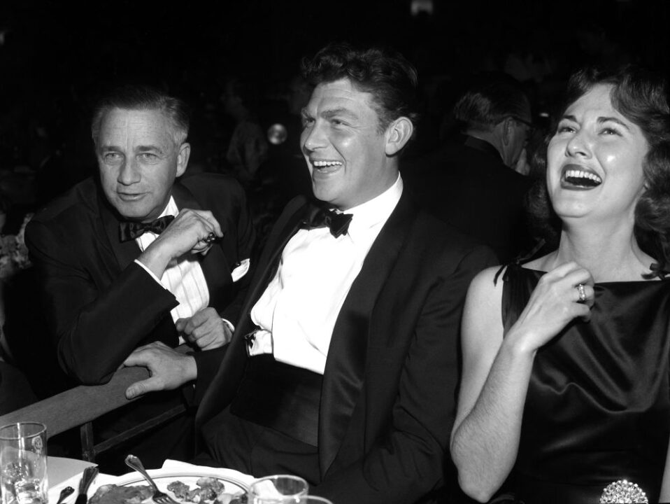 LOS ANGELES - FEBRUARY 2: Actor Andy Griffith (center) poses for a photo with his wife Barbara and producer/director Mervyn LeRoy (left) at the Screen Directors Dinner on February 2 1957 in los Angeles, California