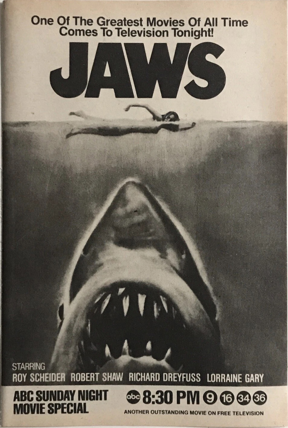 promo print ad for the 1979 TV premiere of the movie "Jaws." The main image is the classic illustration of the shark swimming up toward an unsuspecting swimmer. At the top is the movie's title treatment, above which reads: "One of the Greatest Movies of All Time Comes to Television Tonight!" Near the bottom is a list of the film's actors, below which reads: "ABC Sunday Night Movie Special." On the bottom right is the ABC logo, along with the 8:30pm start time of the movie.