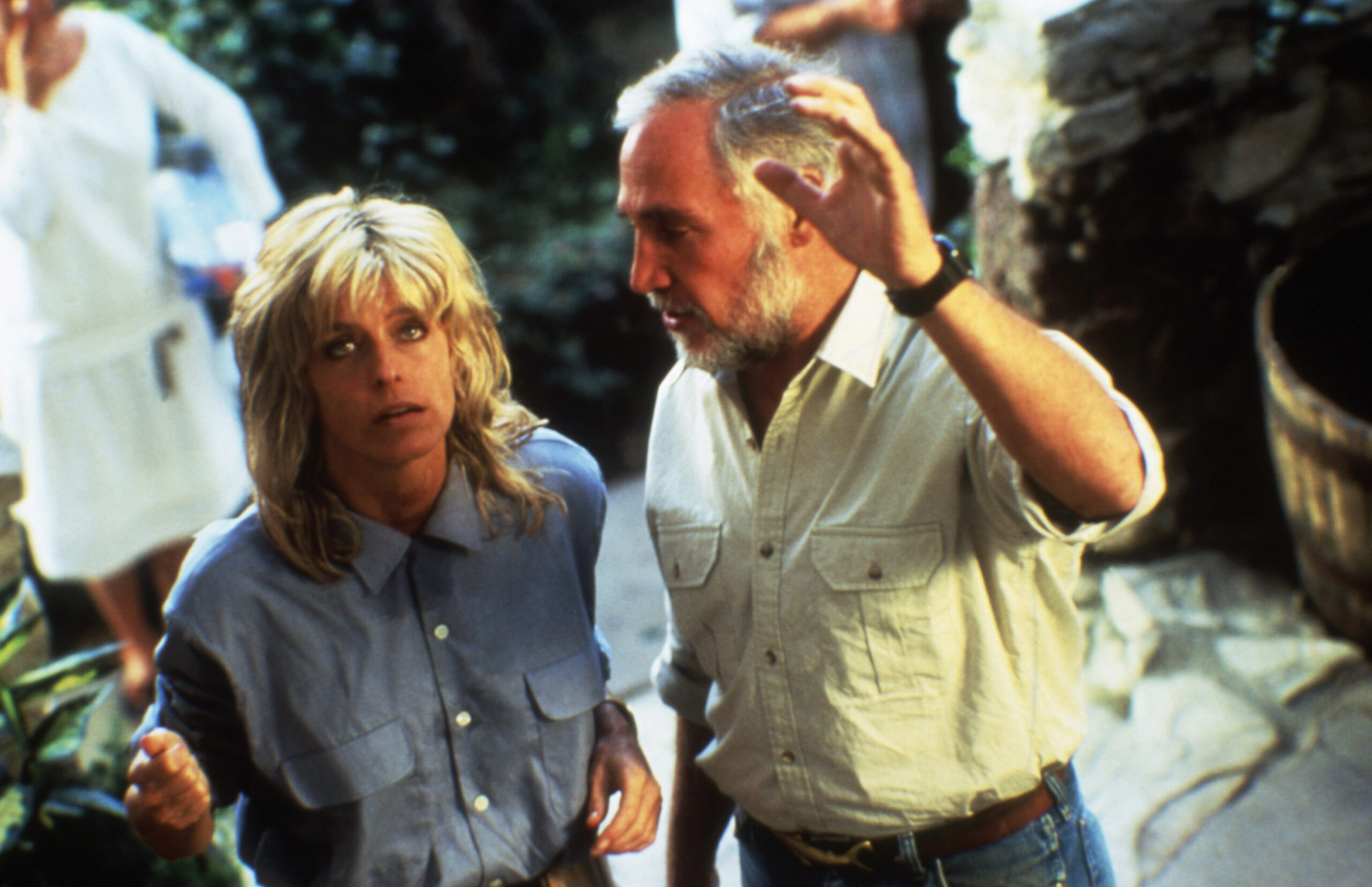 EXTREMITIES, Farrah Fawcett, director Robert M. Young on set, 1986