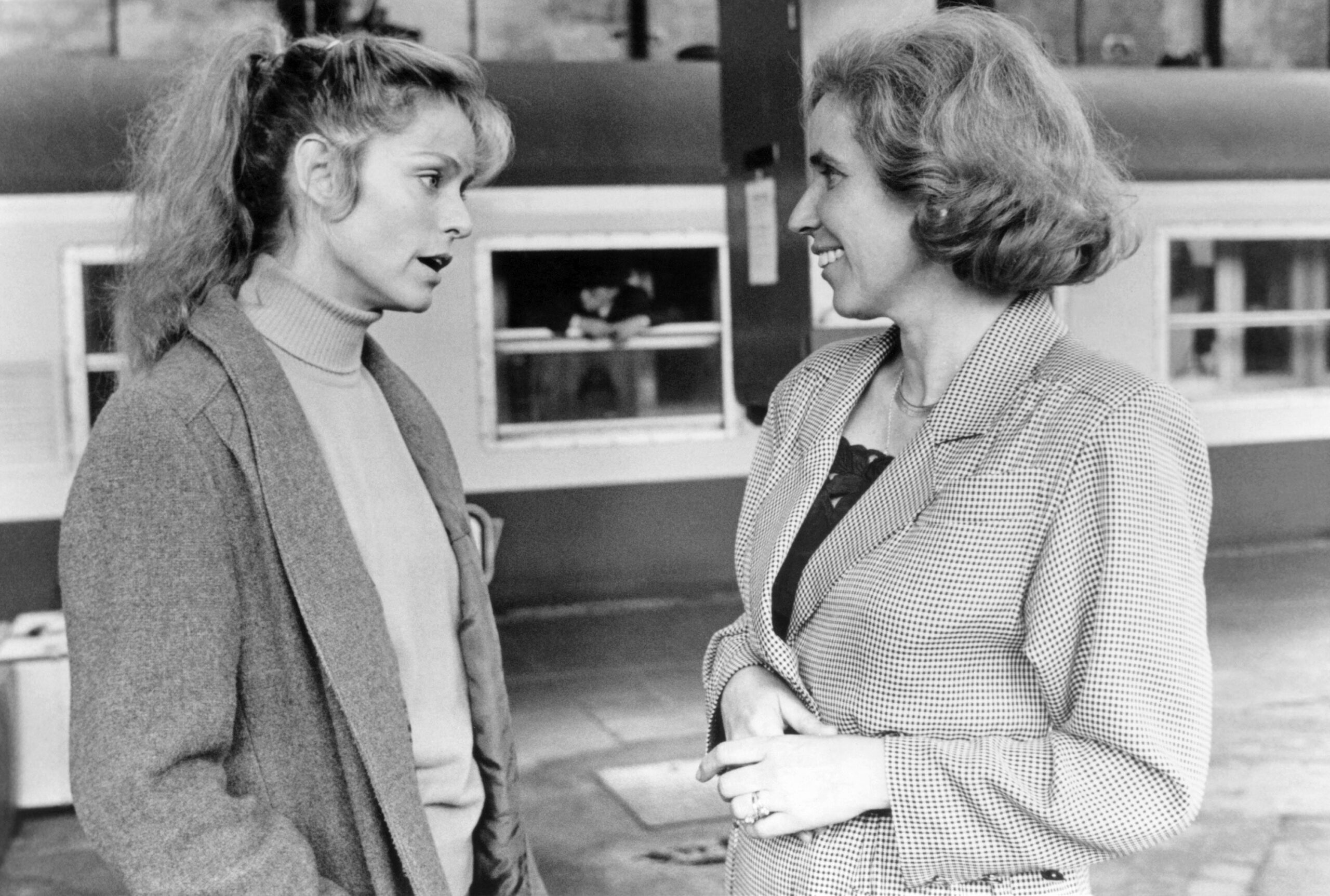 NAZI HUNTER: THE BEATE KLARSFELD STORY, left to right: Farrah Fawcett sharing a moment with the woman she portrays, Beate Klarsfeld, on location in France, 1986. ©ABC/courtesy Everett Collection