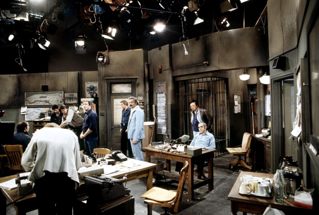 BARNEY MILLER, from left, Gregory Sierra, Ron Glass, Max Gail, Hal Linden, Jack Soo, Abe Vigoda, on-set, 'Escape Artist,' aired April 10, 1975 (photo by Gene Trindl)