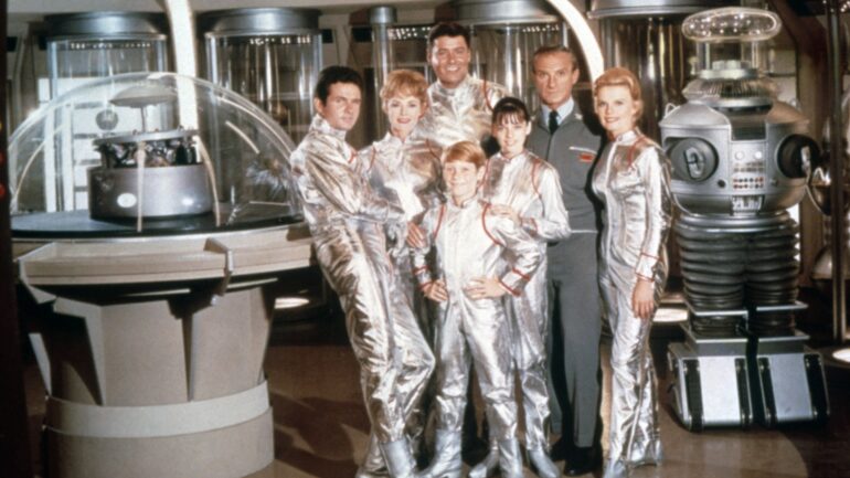 LOST IN SPACE, in front, from left: Mark Goddard, June Lockhart, Billy Mumy, Angela Cartwright, Jonathan Harris, Marta Kristen; in back: Guy Williams, 1965-1968. ph: TM and Copyright ©20th Century Fox Film Corp. All rights reserved. /TV Guide / Courtesy Everett Collection