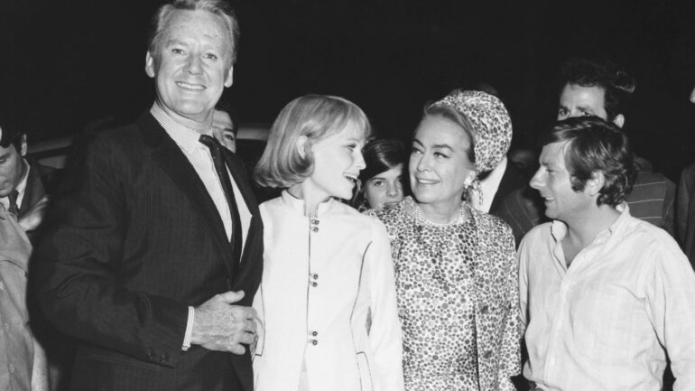 At the premiere of ROSEMARY'S BABY, from left, Van Johnson, star Mia Farrow, Joan Crawford, director Roman Polanski, producer William Castle, 1968