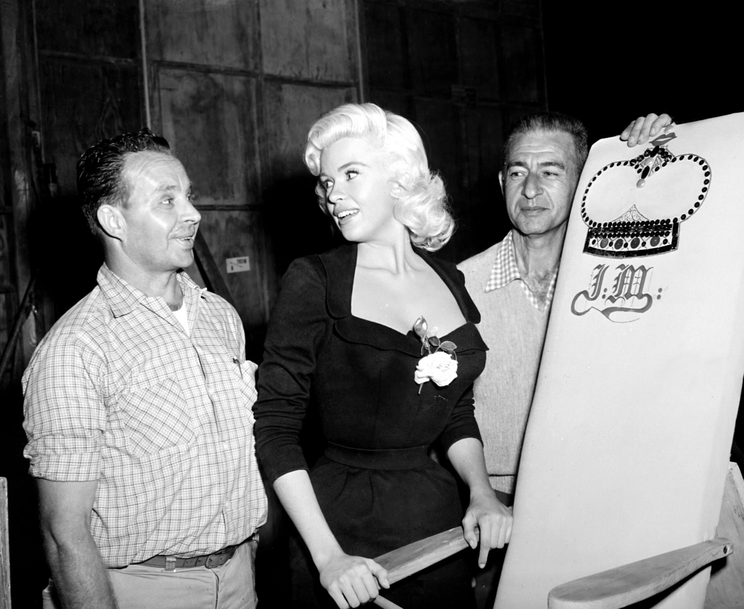 THE GIRL CAN'T HELP IT, Jayne Mansfield, pretending to be pleased with the suggestive slant board presented to her, on-set, 1956.