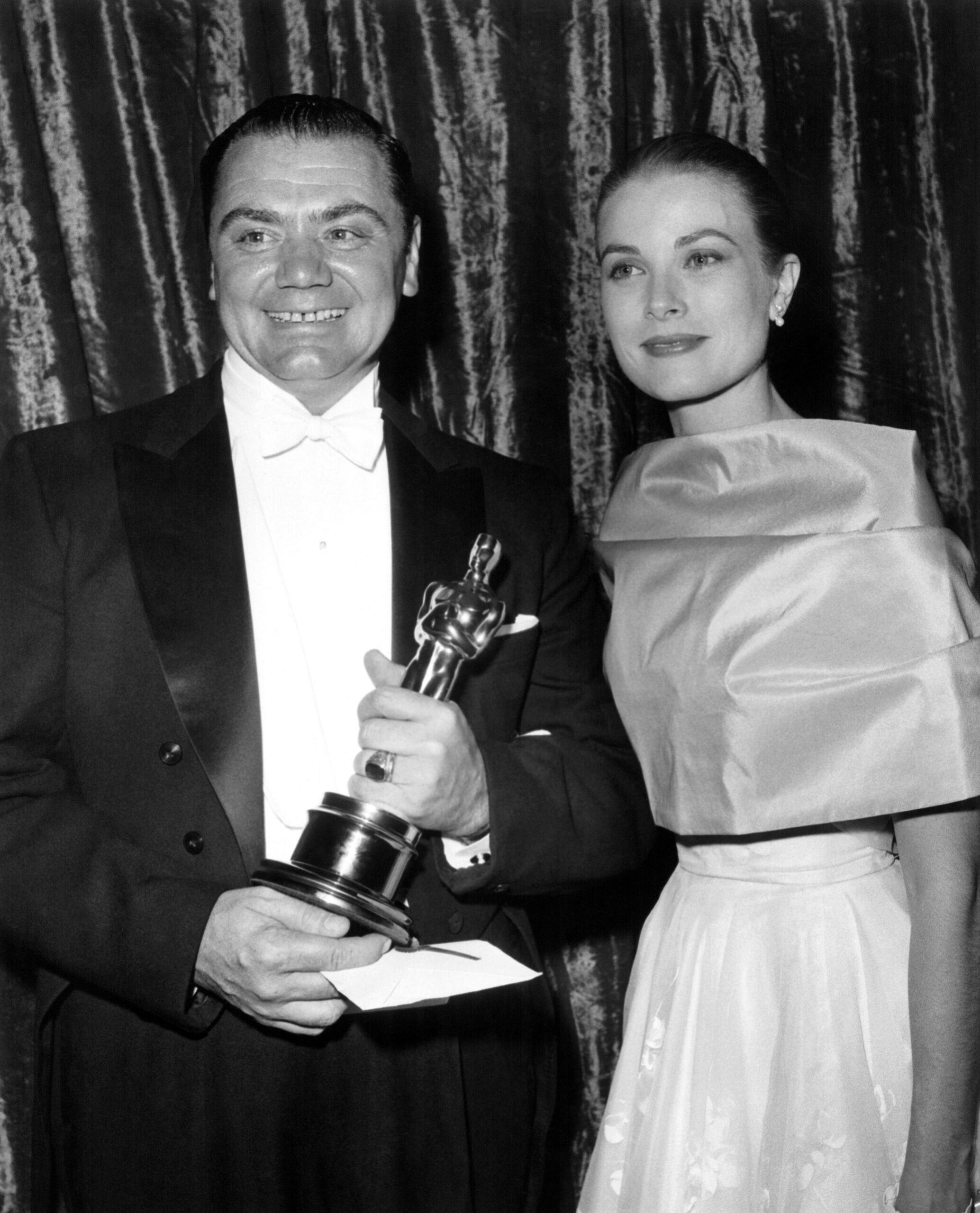 Ernest Borgnine winning Oscar for MARTY with presenter Grace Kelly, 1956