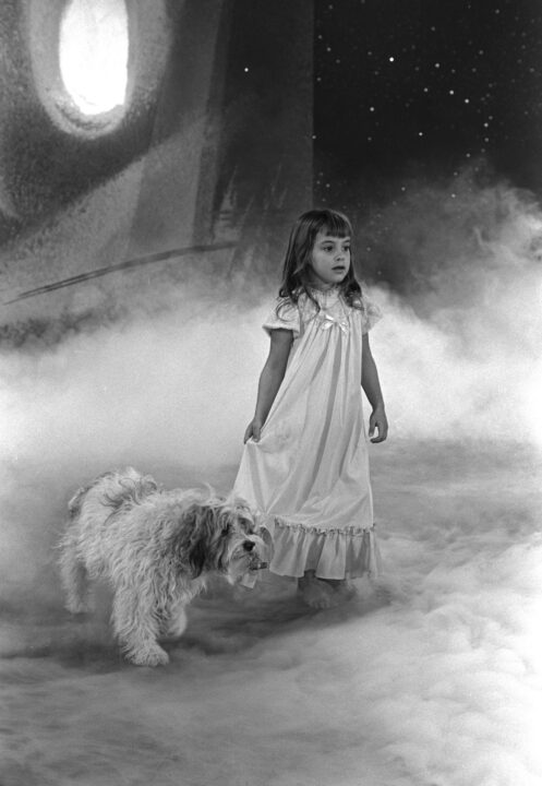 Twilight Zone episode, "Little Girl Lost" originally aired on CBS on March 16, 1962. Tracy Stratford as Tina, a little girl lost in another dimension beneath her bed. She is wearing her nightgown and walking beside her dog in a misty realm. Photo session dated February 2, 1962.