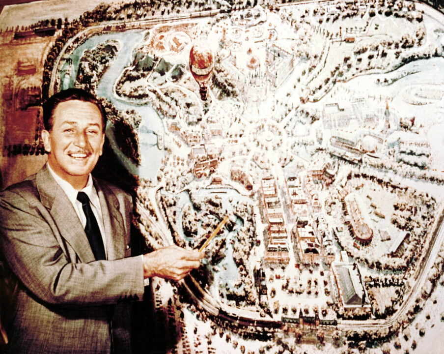 Walt Disney with a map of Disneyland, ca. 1954