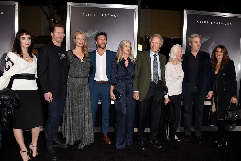(L-R) Graylen Eastwood, Stacy Poitras, Alison Eastwood, Scott Eastwood, Christina Sandera, Clint Eastwood, Maggie Johnson, Kyle Eastwood and Cynthia Ramirez pose at the premiere of Warner Bros. Pictures' "The Mule" at the Village Theatre on December 10, 2018 in Los Angeles, California. (Photo by Kevin Winter/Getty Images)
