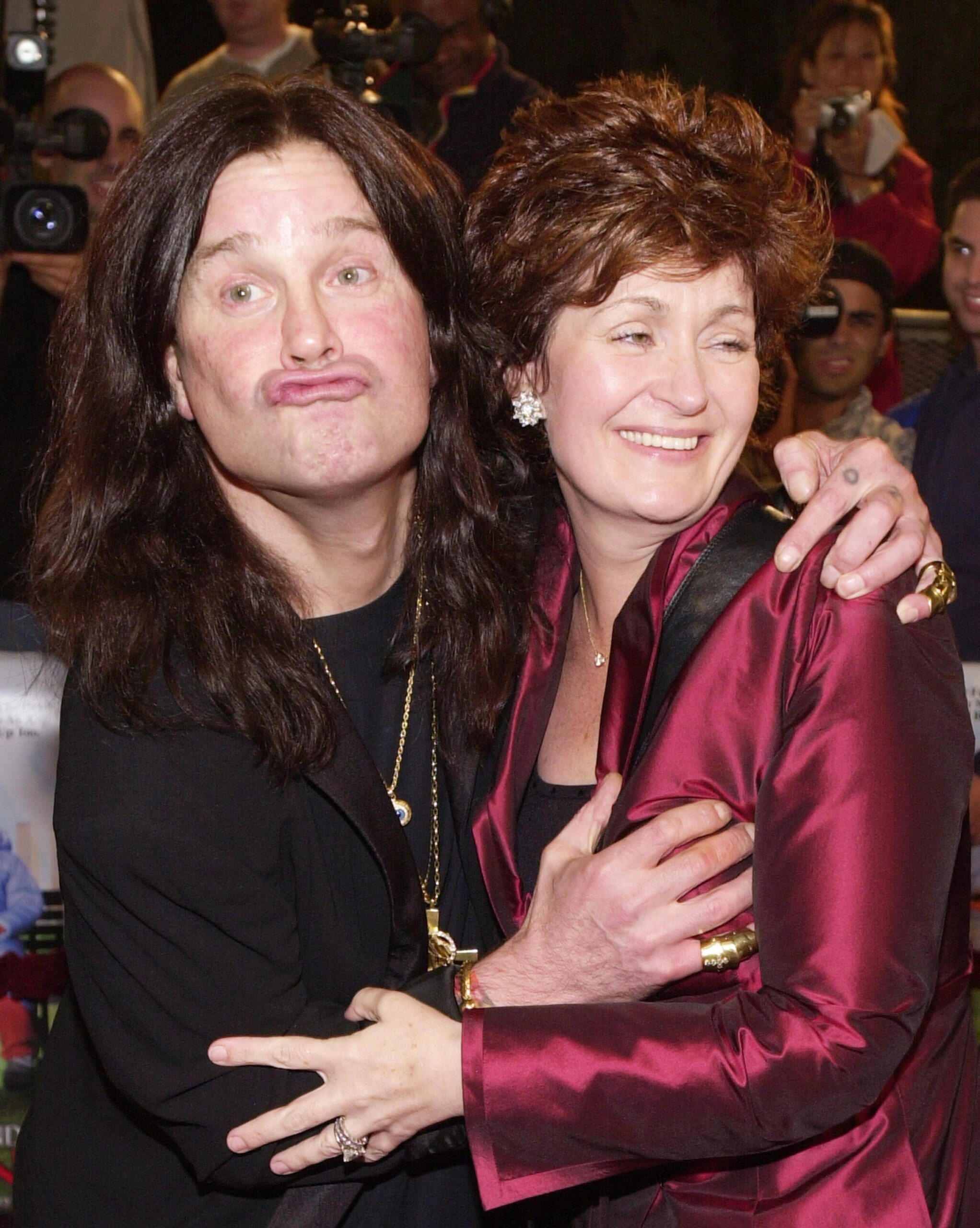 381053 05: Singer Ozzy Osbourne and wife Sharon Arden pose for photographers at the premiere of New Line's 