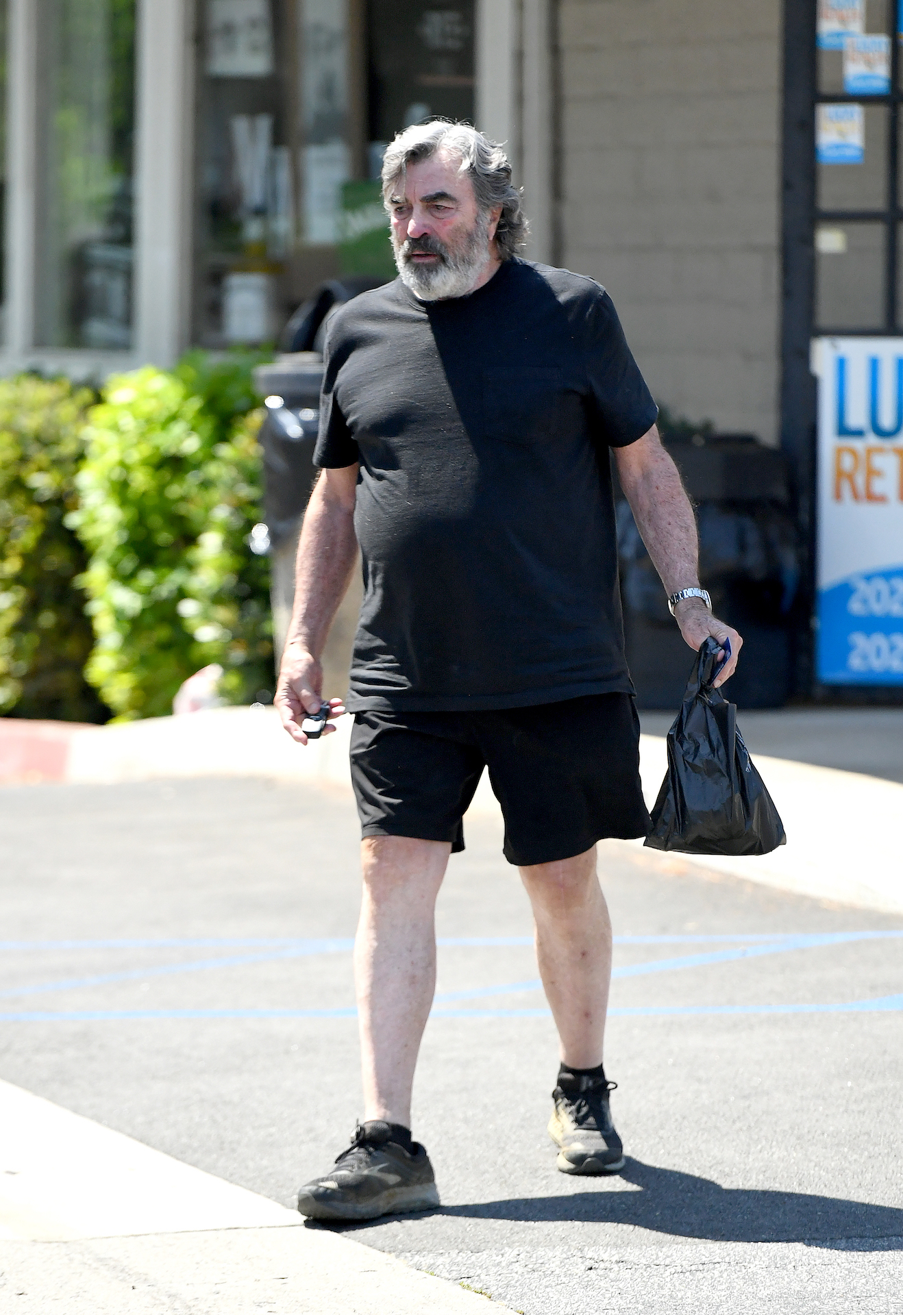 Coleman-Rayner Los Angeles, CA, USA. July 14, 2025 **With video footage** Reclusive Hollywood legend Tom Selleck, 80, makes an extremely rare public outing as he runs errands and grabs a fast food lunch in his California neighborhood. The Magnum P.I. alum, who has been laying low at his $12 million avocado ranch since the shock cancelation of Blue Bloods late last year, broke cover on the afternoon of July 14, 2025, where he started out at his local gym before heading to a drive thru McDonald’s. He ordered a Big Mac and soda from the fast food chain and sat quietly in the car park to eat his lunch. He then went on to an office building where he was seen filing undisclosed paperwork. Tom finally finished his chores with a quick trip to a local convenience store where he opted for a bag of baked Lays chips, which he again ate in the quiet of a car park. Tom then drove home in his white pick-up truck. He was wearing a black T-shirt, shorts and sneakers. Separate video footage shows him walking around in between appointments. CREDIT MUST READ: Jeff Rayner / Coleman-Rayner