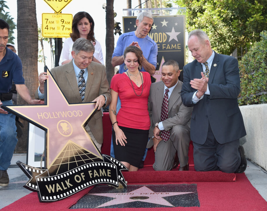 Singer/songwriter Joe Henry and (Bottom L-R) Hollywood Chamber of Commerce president / CEO Leron Gubler, Jesse Belle Denver, John Denver's daughter, Zachary Deutschendorf, John Denver's son and Los Angeles councilman Tom LaBonge attend the ceremony posthumosly honoring John Denver with the 2,531st star on the Hollywood Walk of Fame on October 24, 2014 in Hollywood, California.