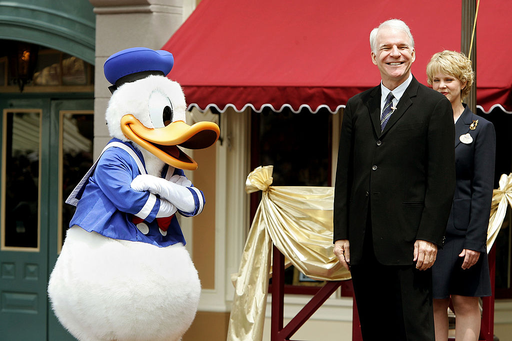  Donald Duck, former Disneyland cast member, actor Steve Martin and Disneyland Ambassador Becky Phelps unveil "Disneyland: The First 50 Magical Years," a historical exhibit during the Disneyland 50th Anniversary Celebration at Disneyland Park on May 4, 2005 in Anaheim, California