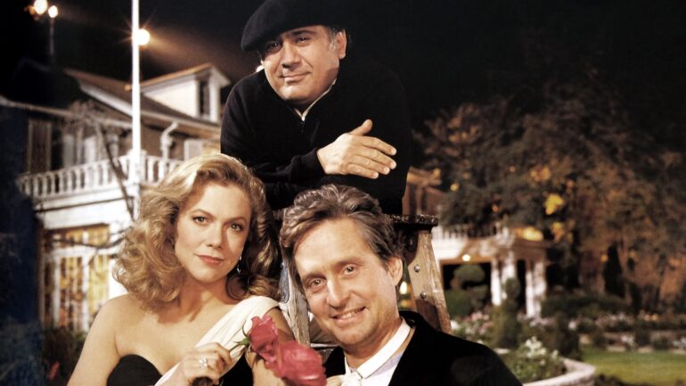 THE WAR OF THE ROSES, from left, Kathleen Turner, director and costar Danny DeVito, Michael Douglas, 1989. TM &