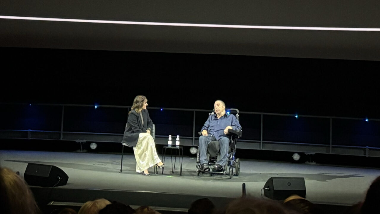 Tim Curry and moderator, Director of Film Programs at the Academy Museum of Motion Pictures KJ Relth-Miller