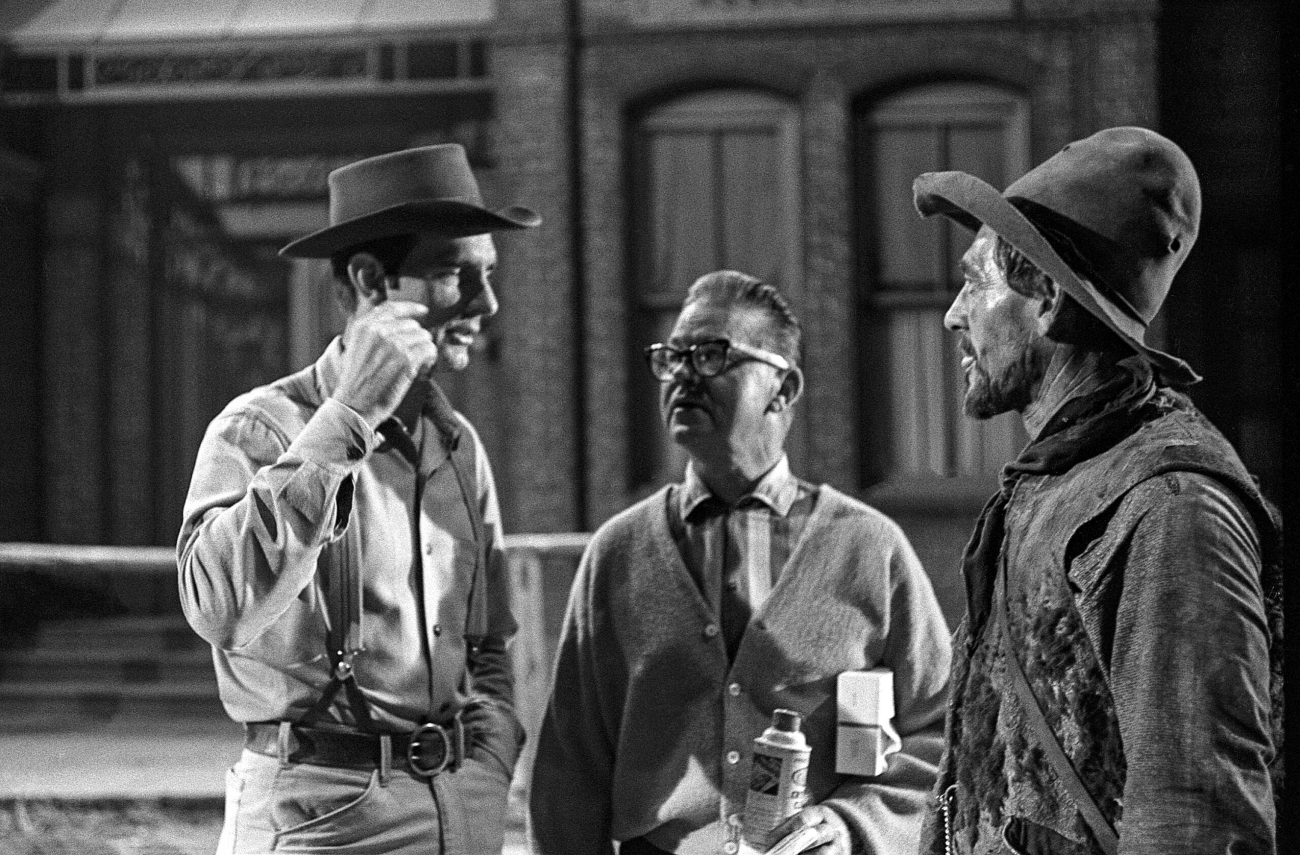 GUNSMOKE, from left: Dennis Weaver, Glen Alden (makeup artist), Ken Curtis, on set, (November 5, 1963), 1955-1975. ph: Bob Vose/TV Guide/Courtesy Everett Collection