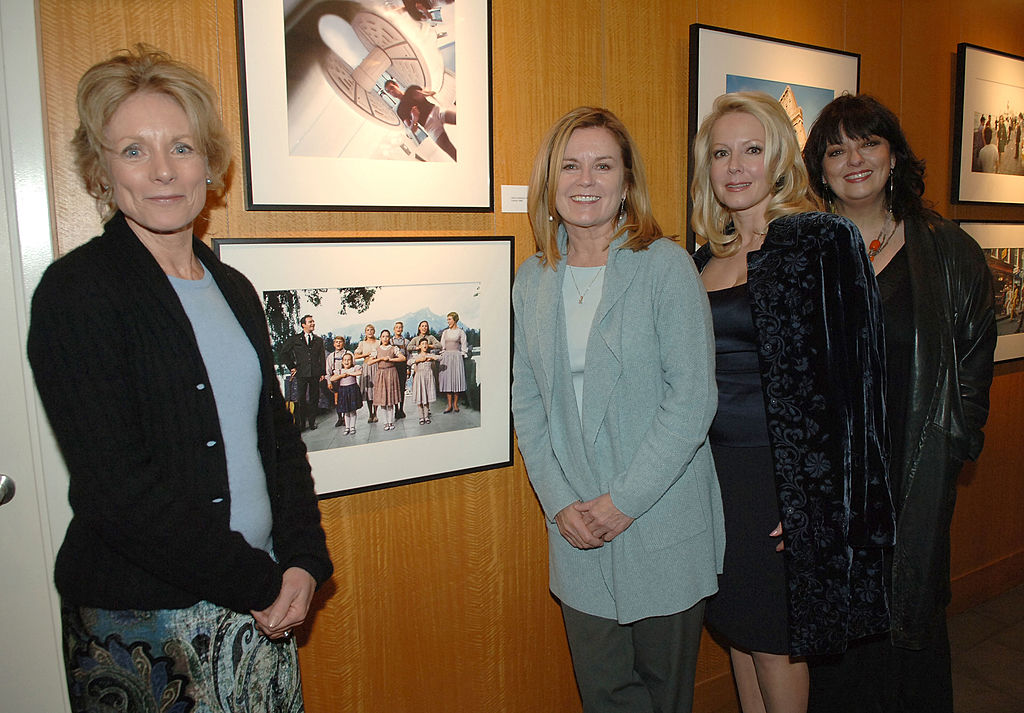 Actors Charmian Carr, Heather Menzies, Kym Kareth and Angela Cartwright pose in front of a picture of them from the "Sound of Music" taken by Douglas Kirkland at the Grand Opening of the Academy of Motion Picture Arts and Sciences Winter 2008 Exhibitions at the Academy's Grand Gallery on January 17, 2008 in Beverly Hills, California