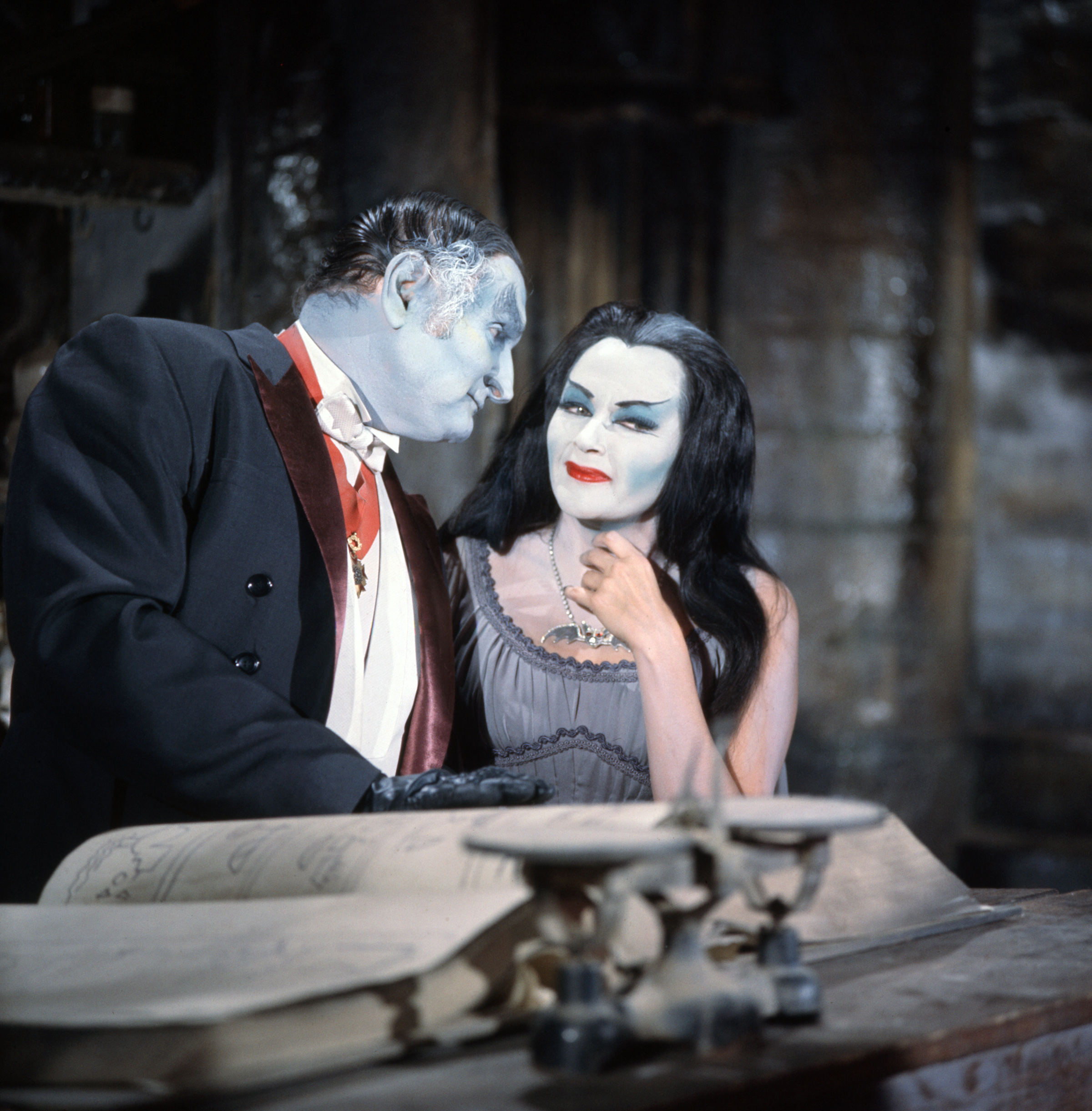 Pictured from left is Al Lewis (as Grandpa) and Yvonne De Carlo (as Lily Munster) in the CBS series, THE MUNSTERS. Premier episode aired September 24, 1964.