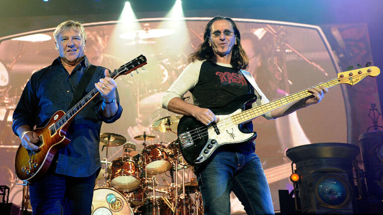 Rush guitarist Alex Lifeson, drummer Neil Peart and singer/bassist Geddy Lee perform at the MGM Grand Garden Arena during a stop of the band's Time Machine Tour August 14, 2010 in Las Vegas, Nevada