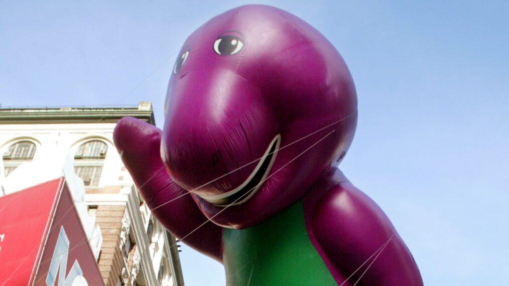 NEW YORK - NOVEMBER 28: The Barney balloon is carried past Macy's department store during the 76th annual Macy's Thanksgiving Day Parade November 28, 2002 in New York City. There were a total of 13 giant character balloons in the parade. (Photo by Mario Tama/Getty Images)