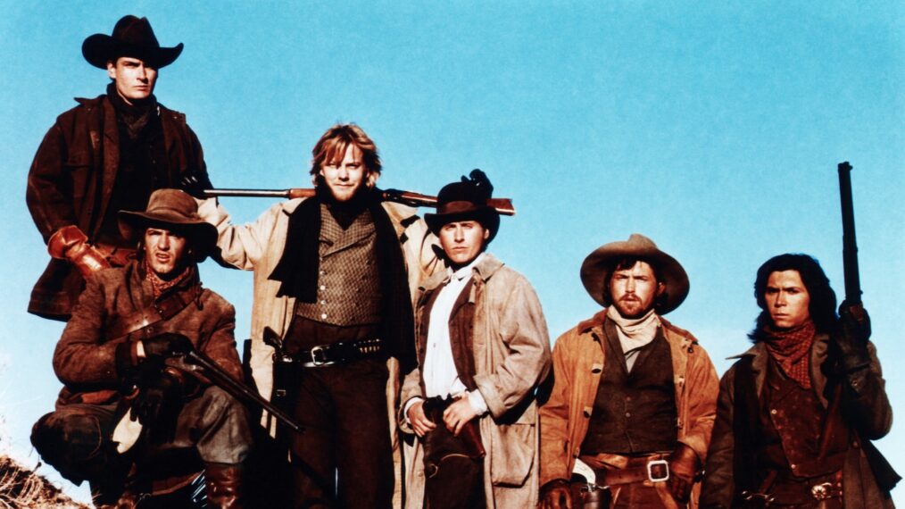 YOUNG GUNS, from left: Charlie Sheen (rear), Dermot Mulroney, Kiefer Sutherland, Emilio Estevez, Casey Siemaszko, Lou Diamond Phillips, 1988, TM & Copyright © 20th Century Fox Film Corp./courtesy Everett Collection