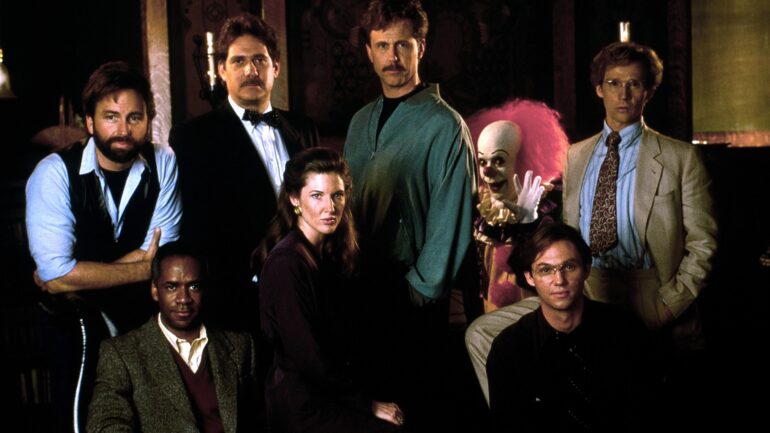 IT, (aka STEPHEN KING'S IT), clockwise from top left: John Ritter, Richard Masur, Harry Anderson, Tim Curry as Pennywise, Dennis Christopher, Richard Thomas, Annette O'Toole, Tim Reid, 1990, ©Warner Bros. / Courtesy Everett Collection