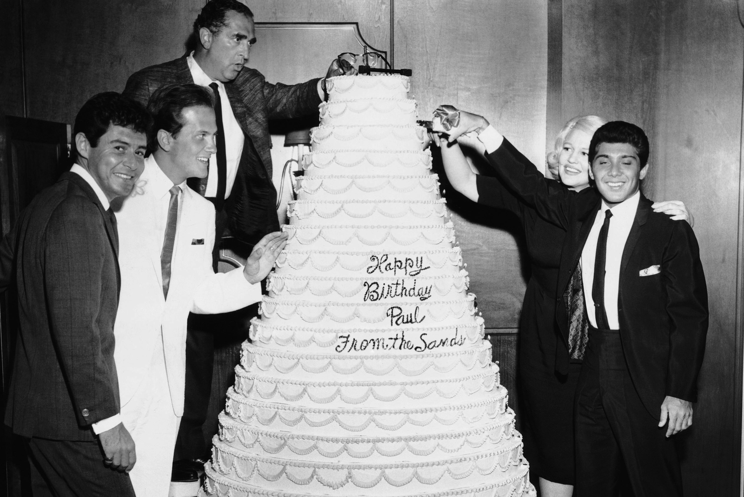 From left, Eddie Fisher, Pat Boone, Phil Foster, Peggy Lee, Paul Anka, celebrating Anka's 21st birthday, Sands Hotel, Las Vegas, 1962