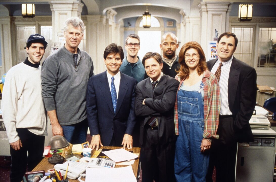 SPIN CITY, Alexander Chaplin (left), Barry Bostwick (gray), Alan Ruck (back center), Michael J. Fox (arms folded), Michael Boatman (bald head), Connie Britton (overalls), Richard Kind (right), 1996-2002.