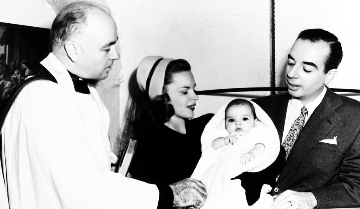 Rev. J. Herbert Smith christens baby Liza Minnlli, as parents Judy Garland and Vincente Minnelli look on, Beverly Hills, June 30, 1947