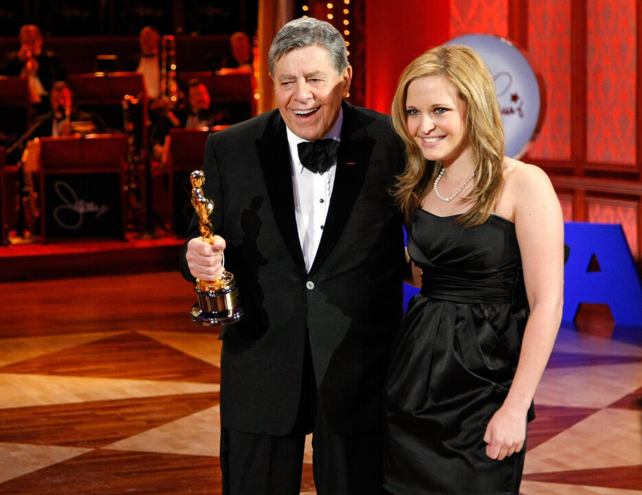 Entertainer Jerry Lewis holds his Jean Hersholt Humanitarian Award Oscar statuette as he appears with his daughter Danielle Lewis during the 44th annual Labor Day Telethon to benefit the Muscular Dystrophy Association at the South Point Hotel & Casino September 6, 2009 in Las Vegas, Nevada. 