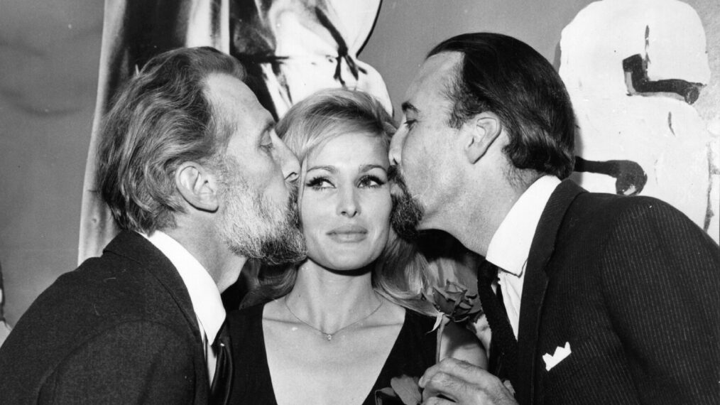 19th August 1964: Swiss film actress Ursula Andress with English actors Christopher Lee and Peter Cushing at a cocktail party in London. All are stars of the film 'She'.