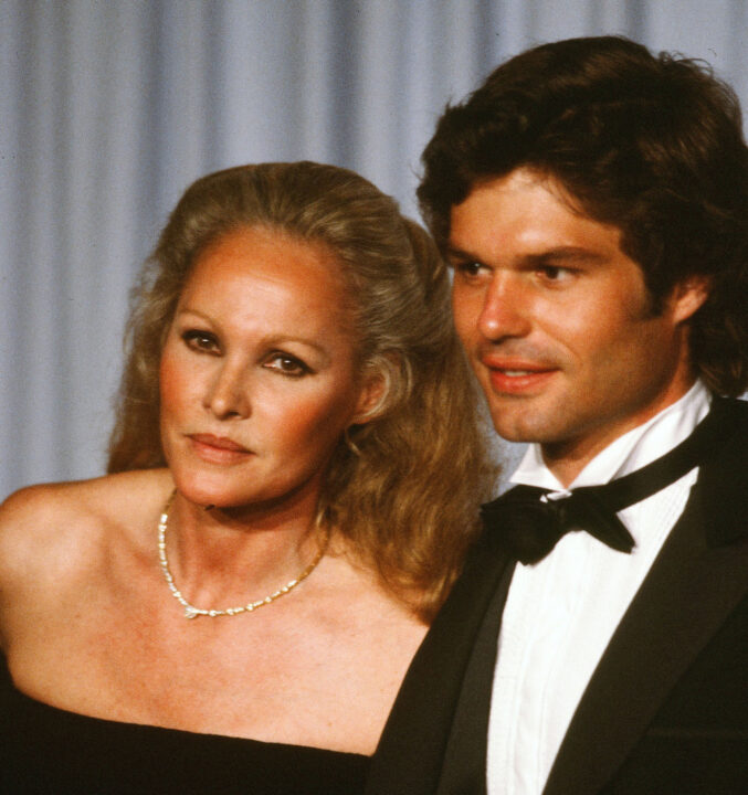 Actress Ursula Andress with actor Harry Hamlin pose backstage during the 54th Academy Awards at Dorothy Chandler Pavilion in Los Angeles,California. 