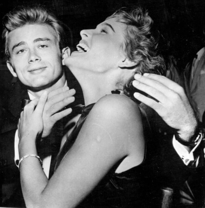 circa 1954: American actor James Dean (1931 - 1955) with Swiss actress Ursula Andress