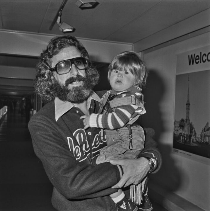American record and film producer Lou Adler with his son Nicholai or Nic Adler at Heathrow Airport in London, UK, 13th April 1974. Nic's mother is Swedish actress Britt Ekland