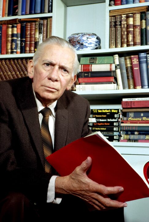 Ray Collins, at home with his collection of Perry Mason books and scripts, 1961