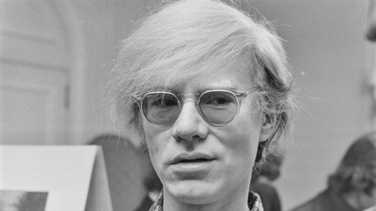 American pop artist Andy Warhol (1928 - 1987) at the Roundhouse in London, which is showing his play 'Andy Warhol's Pork', London, UK, July 1971