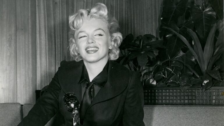 Marilyn Monroe at a London press conference at the Savoy Hotel, prior to filming THE PRINCE AND THE SHOWGIRL, 1956 -