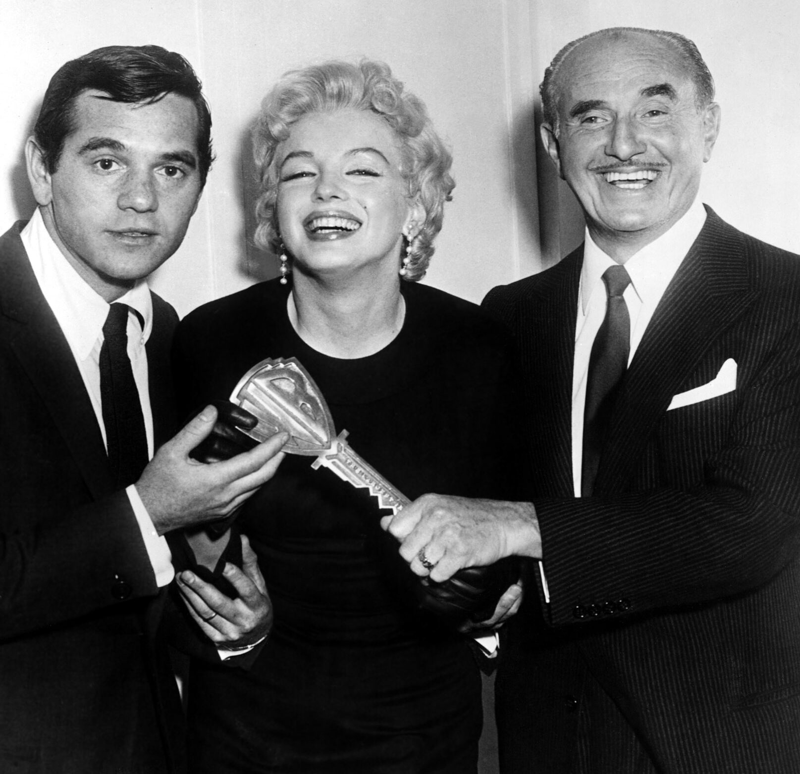 Milton Greene, Marilyn Monroe, Jack Warner at press conference announcing production of PRINCE AND THE SHOWGIRL, 1957