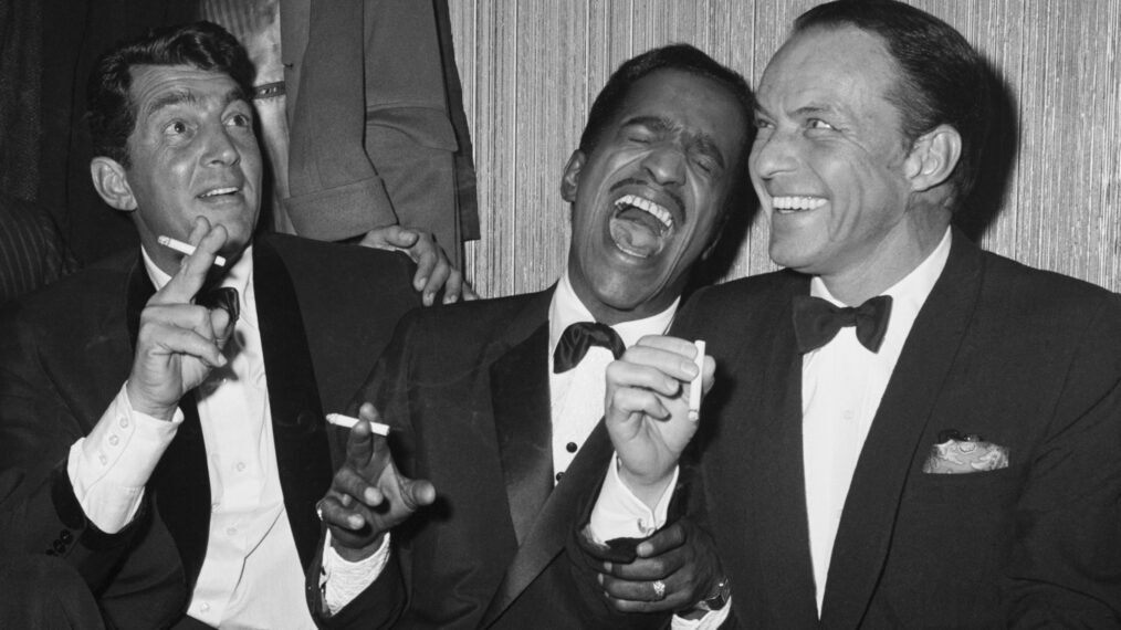 Rat Pack members Dean Martin, Sammy Davis Jr., and Frank Sinatra as the group unwinds backstage at Carnegie Hall after entertaining at a benefit performance in honor of Dr. Martin Luther King Jr.