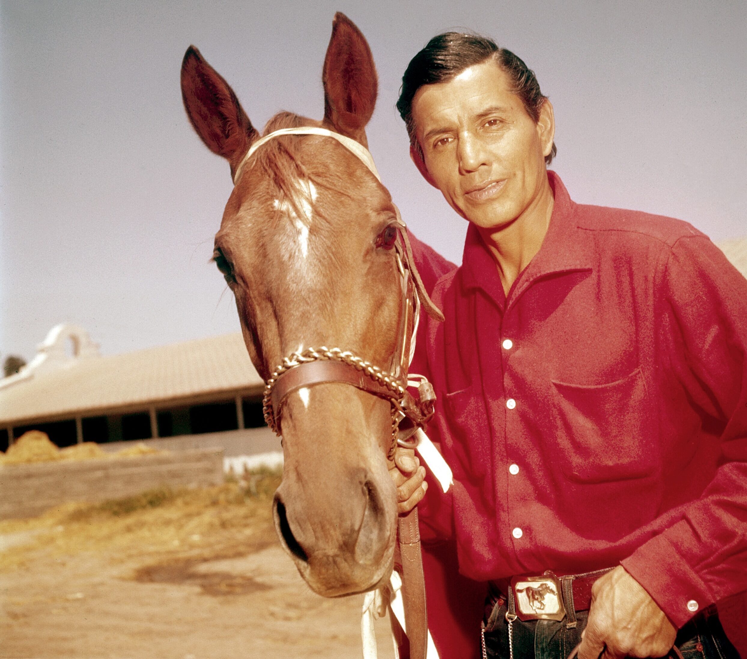 Jay Silverheels of THE LONE RANGER poses with his three-year-old girl race horse horse, Sanderella, at Caliente track in Tijuana, Mexico, 1956. He owns six horses, and keeps the other five at his ranch in the San Fernando Valley north of Hollywood. Sanderella stays at Caliente