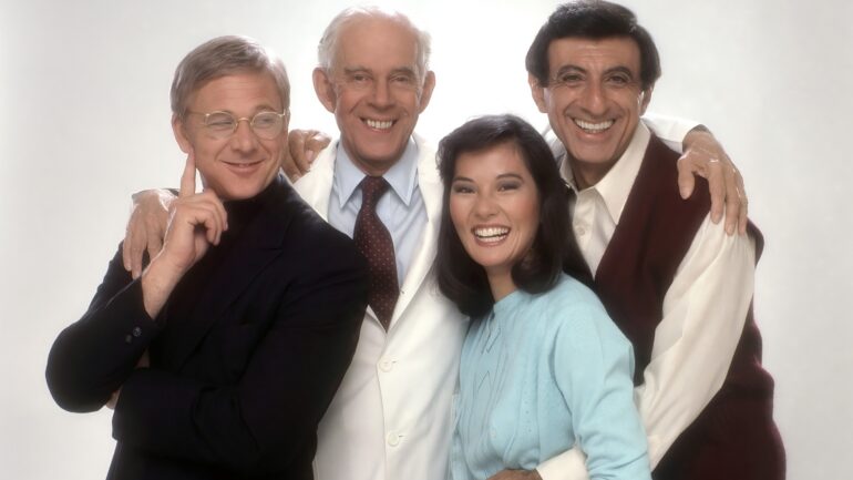 AFTER MASH, from left: William Christopher, Harry Morgan, Jamie Farr, Rosalind Chao, (1983), 1983-1985